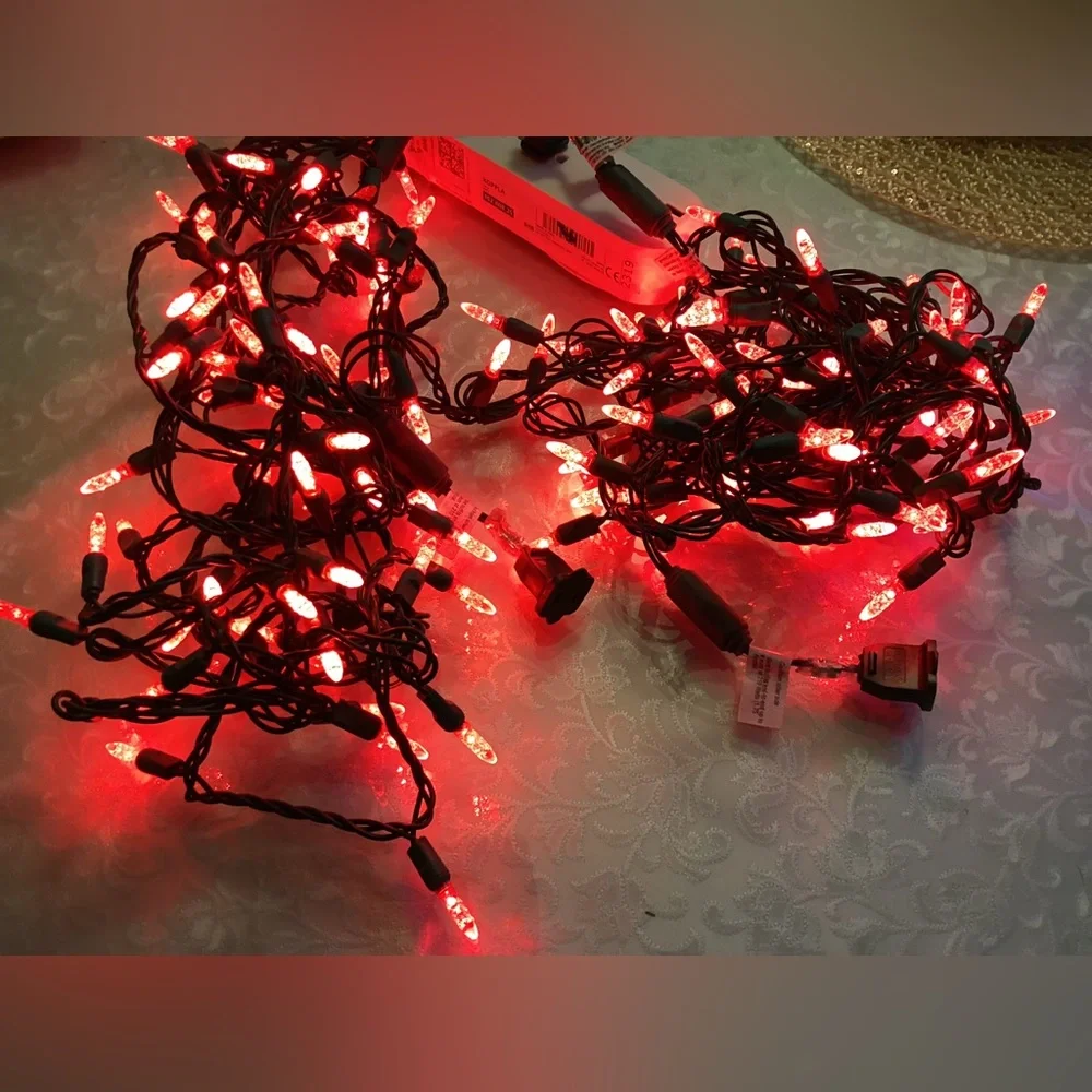 2 Christmas string lights. Red Skinny faceted bulbs 1”